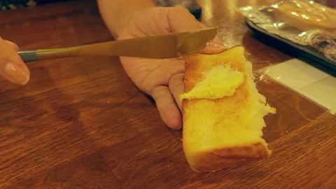 A buttered hand on toast Stock Footage 202619192