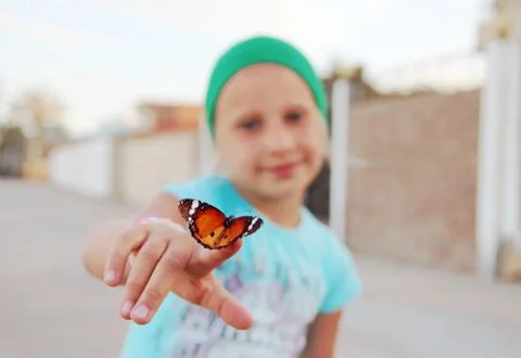 Butterfly on finger Stock Photos