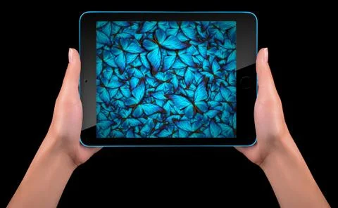 Butterfly flying out from tablet computer Stock-Fotos