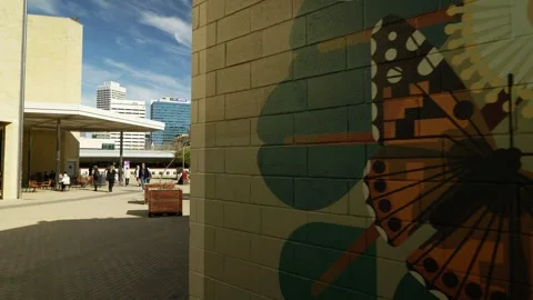 Butterfly mural on wall track to Perth cityscape 6K Stock Footage 311990716