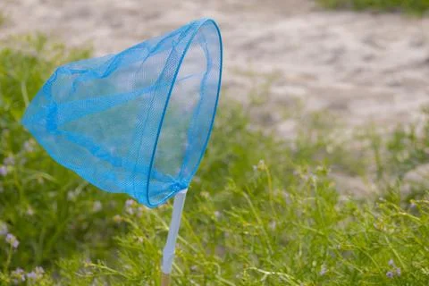 Butterfly net on the seashore. Soft selective focus. Stock Photos
