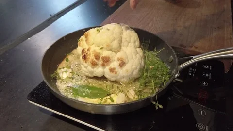 Butterfried cauliflower with fresh herbs Stock Footage 153385877