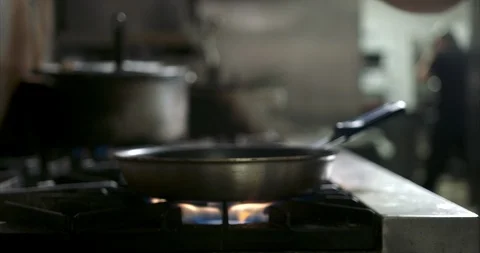 Buttering and oiling a hot saute pan Stock Footage 105377013