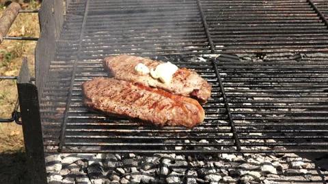 Buttering a beef steak 4K Stock Footage 130797028