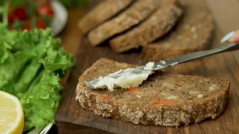 Buttering Fresh Bread, Close-up, Preparing Sandwich for Healthy Morning Breakfas Stock Footage 202873629