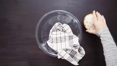 Buttering metal cupcake pan to bake cornbread muffins. Stock Footage 96355507