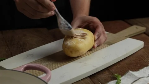 Buttering potato Stock Footage 118020267