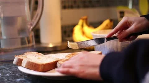 Buttering the toast Stock Footage 21933696