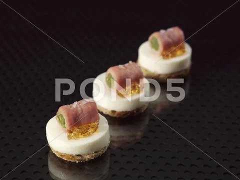 Buttermilk foam with milk-fed veal rolls and green beans Stock Photos