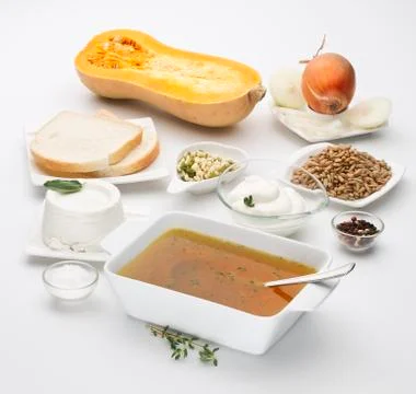 Butternut squash Cucurbita moschata with various ingredients isolated on whit Stock Photos