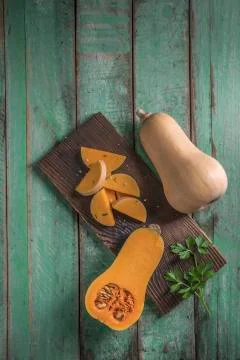 Butternut squash over old wood background Stock Photos