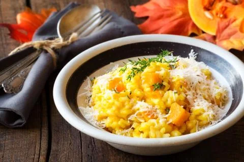 Butternut squash risotto with thyme and parmesan cheese Stock Photos