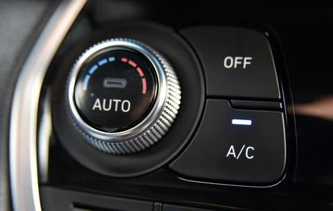 Button for activating the air conditioners on the dashboard passenger car Stock Photos