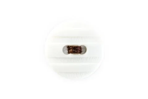 Button with brown thread on white background Stock Photos