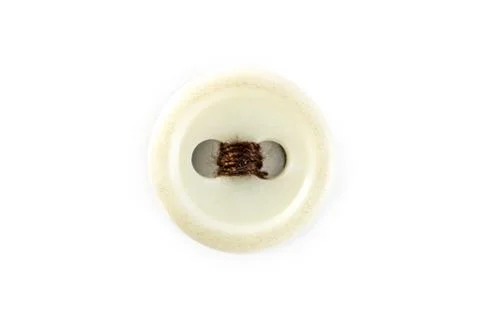 Button with brown thread on white background Stock Photos