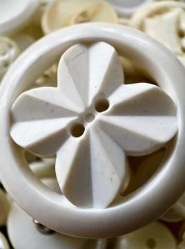 Button, Close up or macro photo, white bakelite or celluloid button Stock Photos