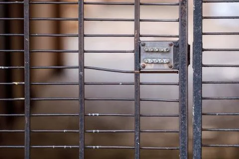 Button code lock on the gate. closed entrance close-up. Stock Photos