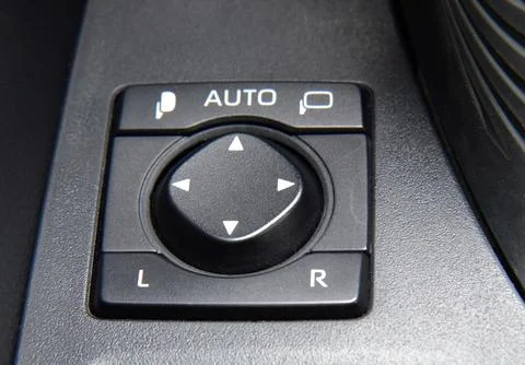 Button to control the side mirrors in the passenger car Stock Photos