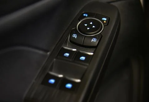 Button to control the side mirrors in the passenger car Stock Photos