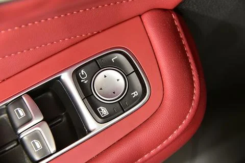 Button to control the side mirrors in the passenger car Stock Photos