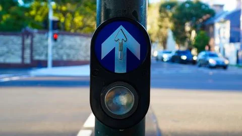 Button to cross the road Australia.Road with vehicles and traffic signs Stock Photos