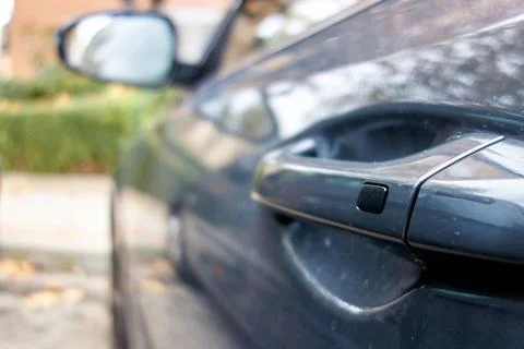 Button on the door handle of a modern car Photos