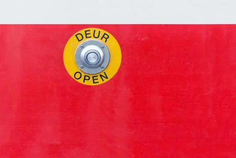 Button for door opening on demand on red colored tram Stock Photos