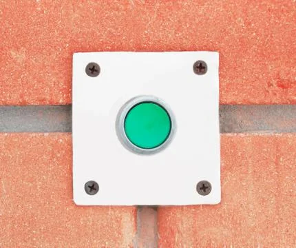 The button of a doorbell on a wall background Stock Photos