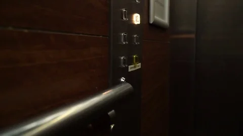 The button in the elevator lights up and goes out Stock Footage 73240240