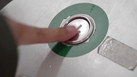 Button on elevator panel signals for ride down Stock Footage 319368208