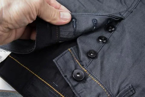 Button fly on a new jeans Stock Photos