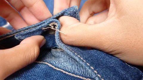 Button on the jeans pant and put it on the closet Stock Footage 150397808