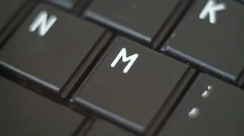 Button M Black PC Keyboard Typing Stock Footage 47310006