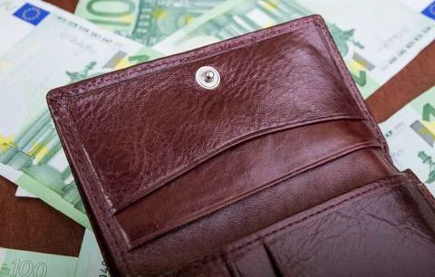 Button on a man's purse close-up on a table Stock Photos