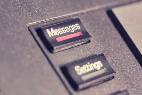 A button with a message text and setup on a landline phone in the office, clo Stock Photos