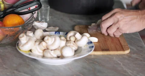 Button mushrooms fine slicing close-up Stock Footage 231619415