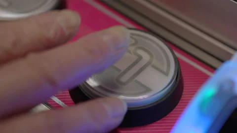 Button with number 1 on it flashing at arcade 4k Stock Footage 144079643