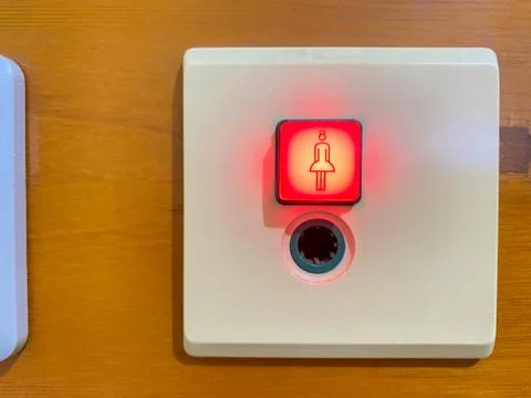 Button of the nurses call system in hospital light on Stock Photos