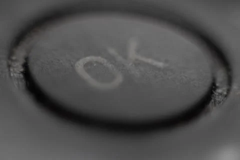 Button ok agree macro background Stock Photos