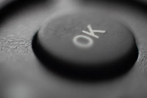 Button ok agree macro background Stock Photos