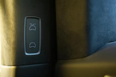 The button to open or close car door. Unlocks the door buttons inside the car to Photos