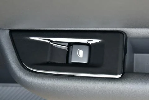 The button for raising the windows in the car Stock Photos