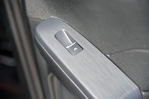 The button for raising the windows in the car Stock Photos