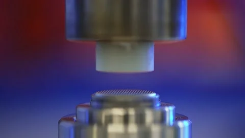 Button Round Cell Battery Assembly in a Press Stock Footage 160257881