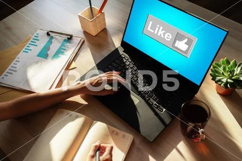 Like button on screen. SMM, Social media marketing concept. Stock Photos