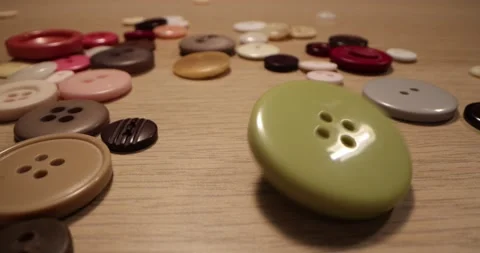 Button for sewing. Button spin on the table. Stock-Footage 168248906