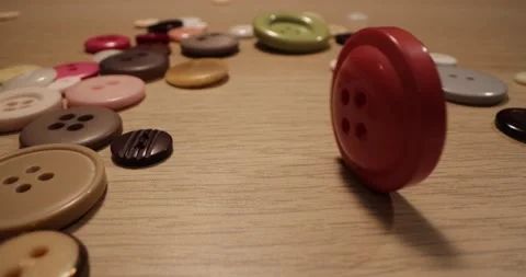 Button for sewing. Button spin on the table. Stock-Footage 168248948