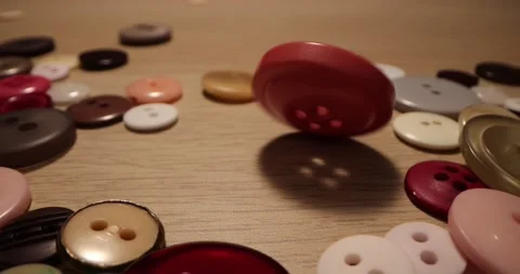 Button for sewing. Button spin on the table. Stock-Footage 168248964