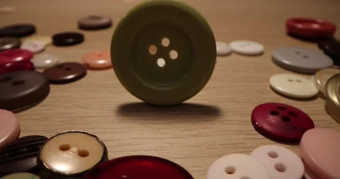 Button for sewing. Button spin on the table. Stock Footage 168248982