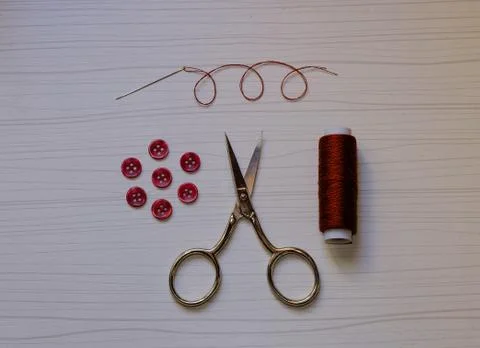 Button sewing kit: buttons, threads, needle, scissors Stock Photos